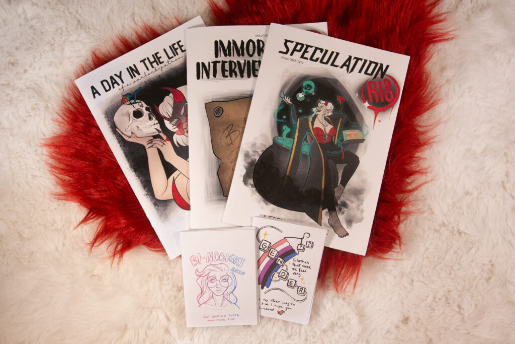 Pile of zines on a fluffy background
